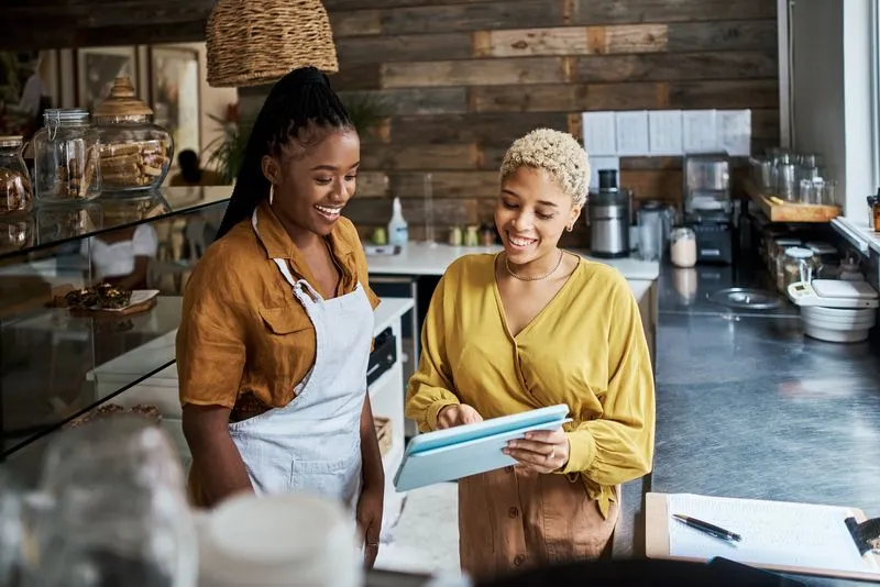 Restaurant staff using digital dashboard to manage offers