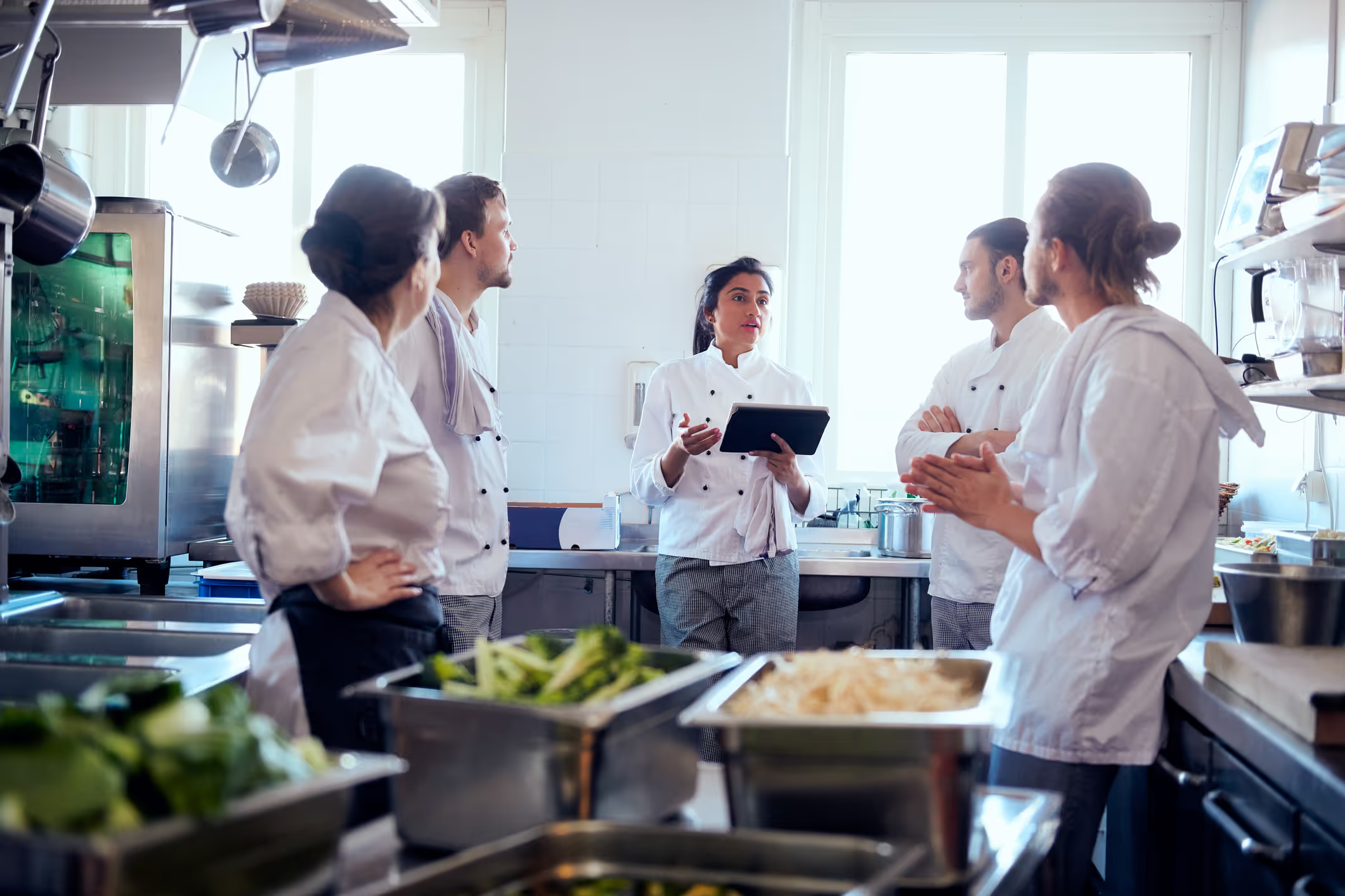 Restaurant staff reviewing data on a tablet